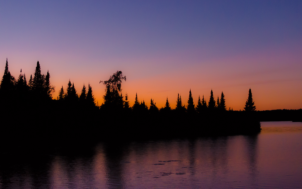 Boundary Waters sunset over the pines